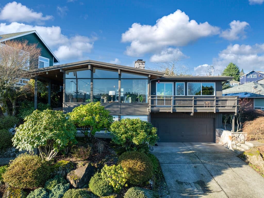 My own Kenneth Koehler house in Seward Park: a wall of glass under a low-pitched roof with deep overhangs, above a rock garden