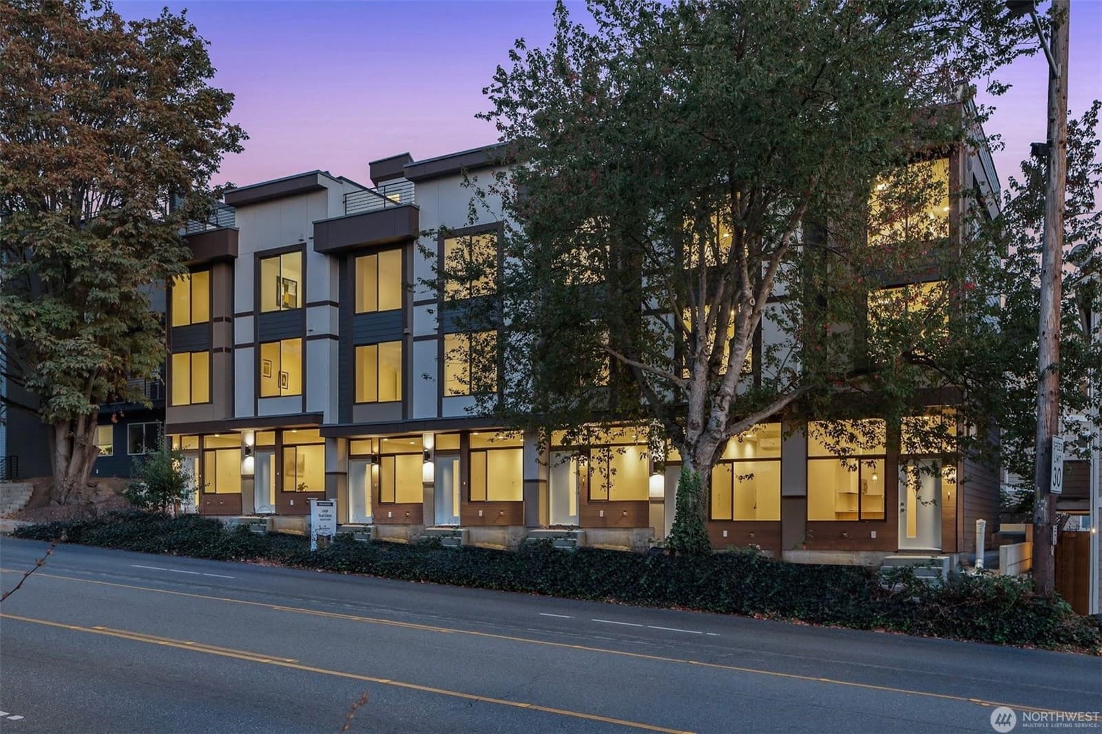 The row seen along the street at dusk