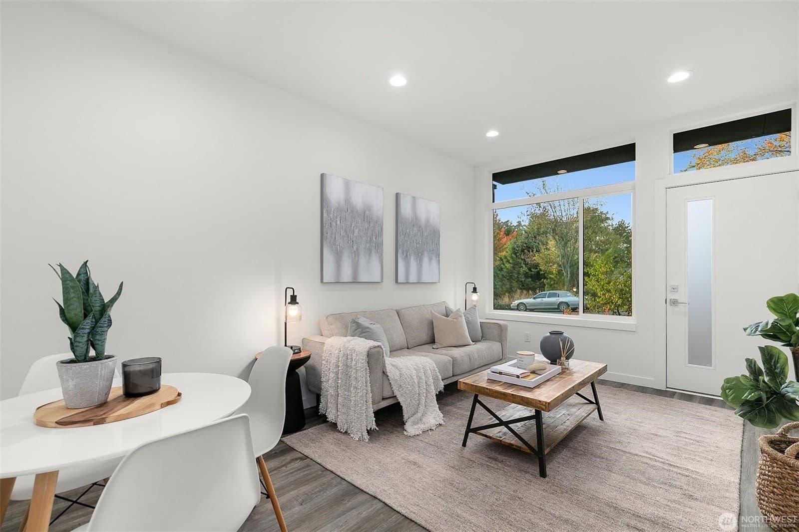 Living area beside the window and door onto the street