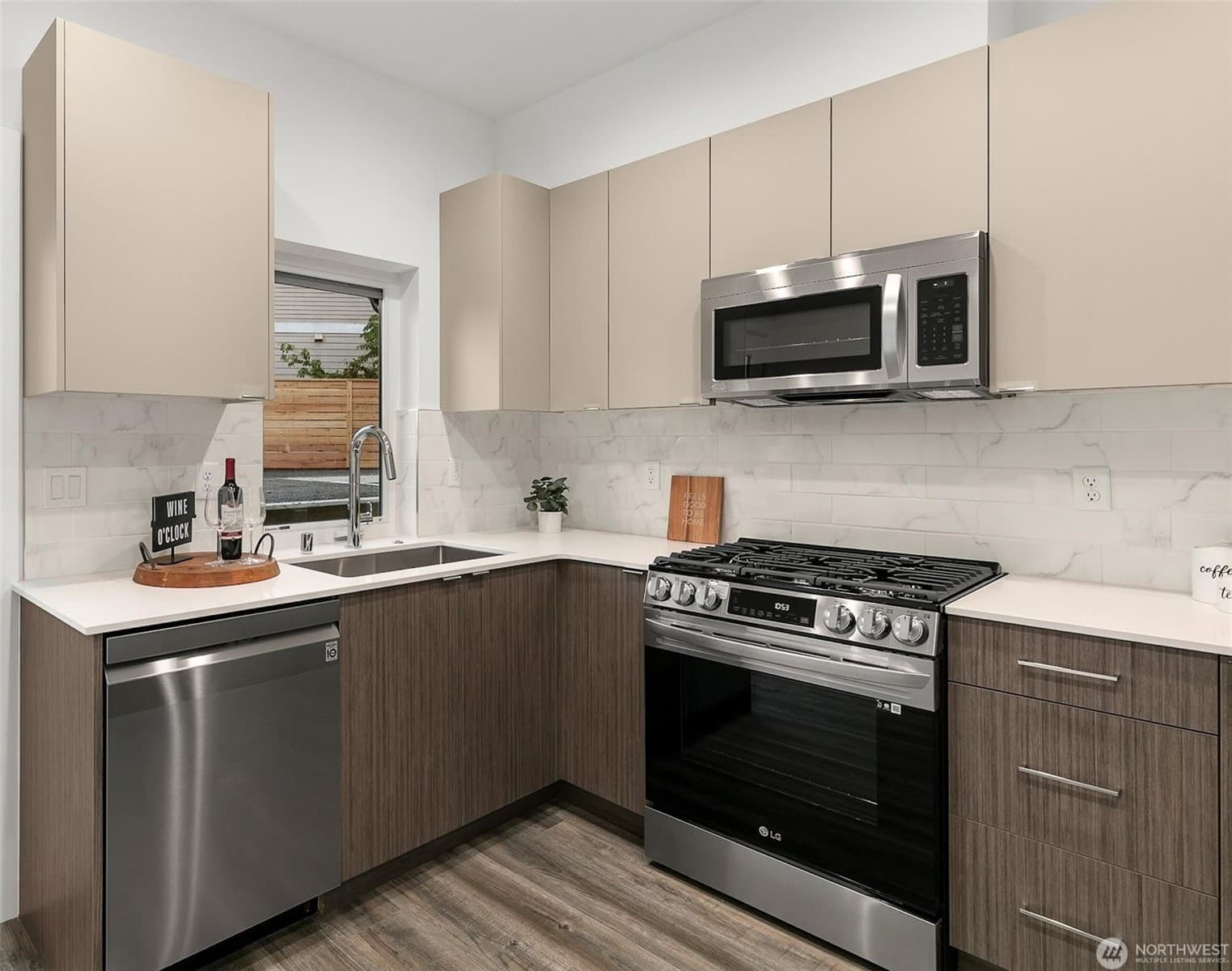 Kitchen with a gas range, quartz counters and stainless appliances