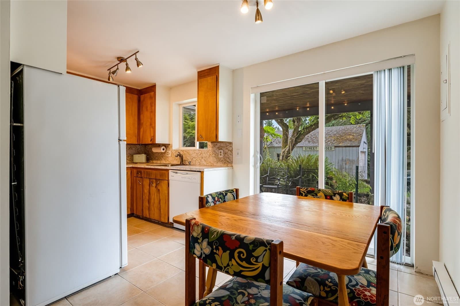Dining area beside the kitchen, with a slider out to the covered patio