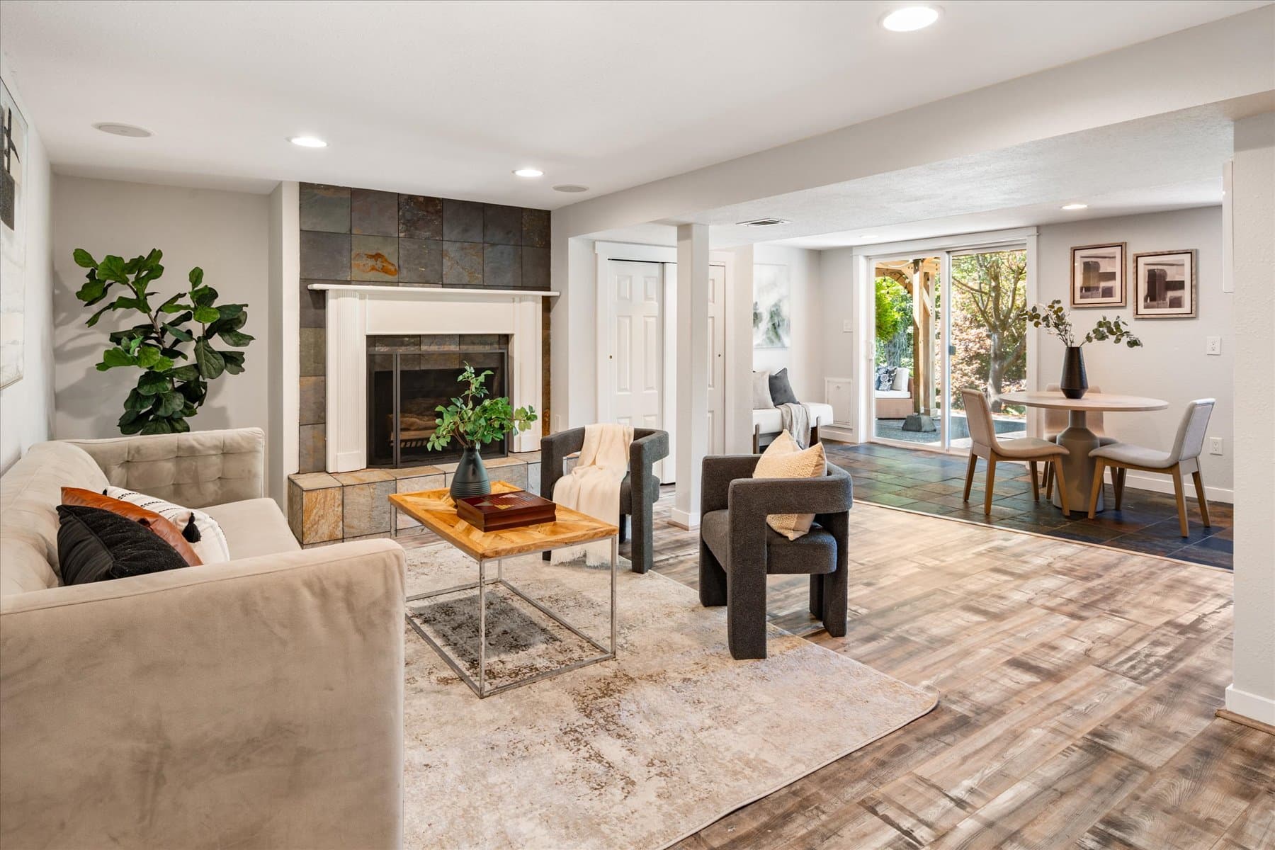 Lower-level family room looking through to the second dining area and the door to the yard