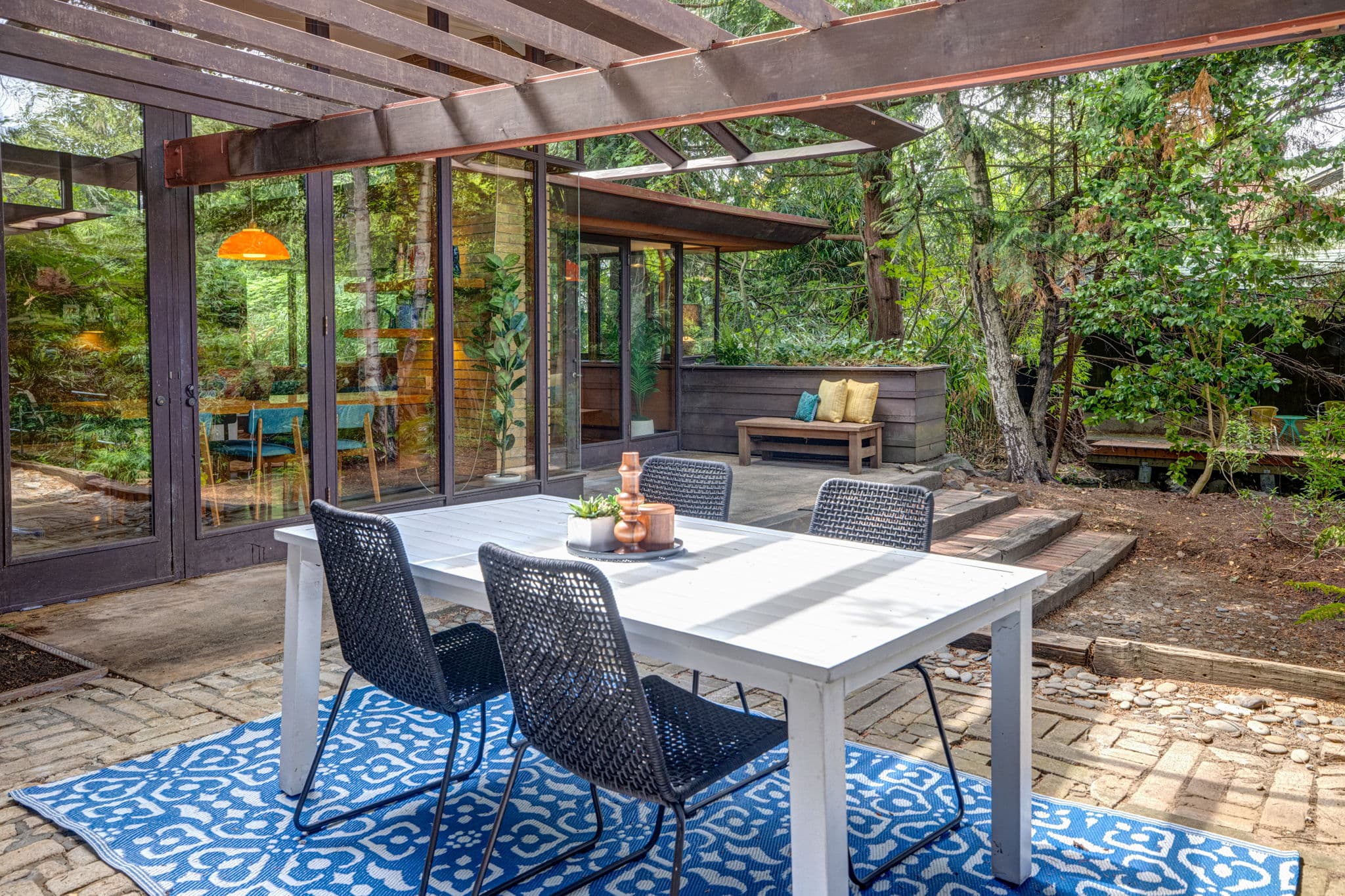 Covered outdoor dining beneath the pergola