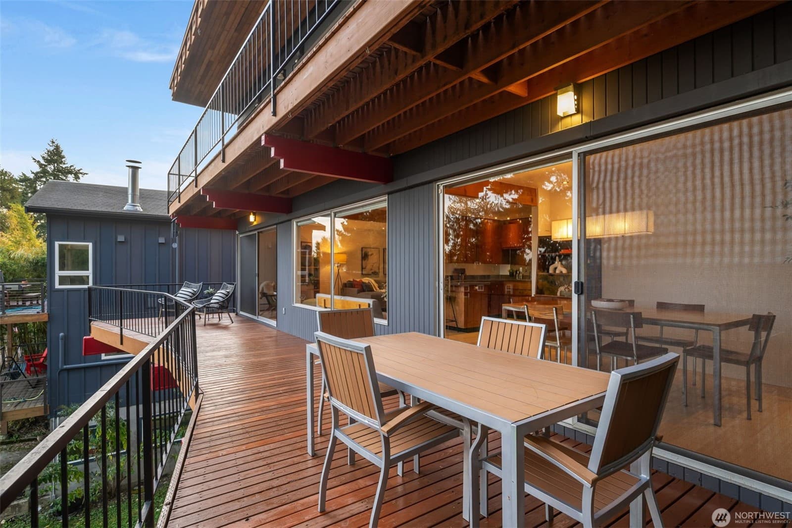 View deck set for dining, with sliders back into the house