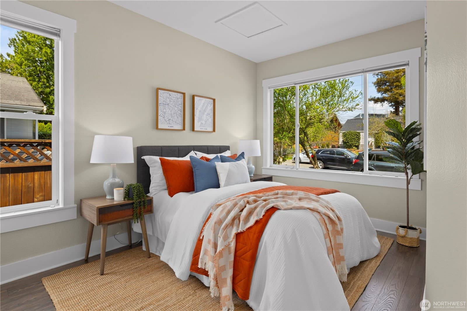Bedroom with a wide window looking onto the garden