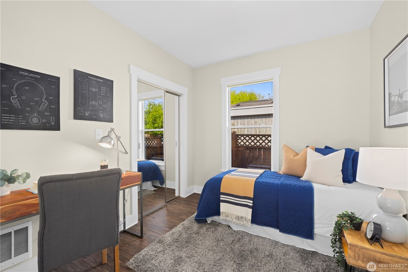 Second bedroom set up with a desk under the window